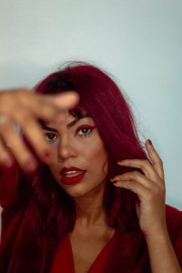 From subtle to statement: Red eyeshadow looks that elevate your look Red eyeshadow is a powerful beauty tool that can instantly take your look from subtle to statement. The bold color is no longer just for daring fashionistas; it’s now a versatile and wearable option for anyone looking to elevate their makeup game. Red eyeshadow looks can be intimidating, but with the proper application and pairing with other shades, it can be a stunning addition to your beauty routine. In this article, we'll explore different ways to incorporate red eyeshadow into your makeup routine. Whether you're a newbie or a seasoned pro, we'll provide inspiration and tips to help you achieve the perfect look. So, get ready to add red-hot vibes to your beauty routine and learn how to create the perfect red eyeshadow look that will make you stand out from the crowd. With our help, you'll be able to master the art of red eyeshadow looks and create a personality that will turn heads and leave a lasting impression. Types of red eyeshadow looks Red eyeshadow looks can be a great way to add warmth and depth to your look. It can make your skin look more radiant and give your face a healthy glow. Red eyeshadow can also be a great way to express your personality and creativity. It's a bold and daring color that can create various looks and moods, from vintage glamour to a modern and edgy look. Here are some unique ideas to incorporate into your routine. 1. Matt red eyeshadow look https://www.pexels.com/photo/red-flower-on-the-person-s-mouth-9553504/ A matte red eyeshadow look is a classic and timeless way to incorporate bold color into your makeup routine. The matte finish gives a sophisticated and elegant look while still making a statement. The key to pulling off a matte red eyeshadow look is to find the right shade of red for your skin tone. A warm-toned red will complement olive and yellow undertones, while a cool-toned red will look great on those with pink and blue undertones. It is perfect for those who want to add a pop of color to their makeup routine without looking too over the top. It's a great way to make a statement without being too bold and can be dressed up or down depending on the occasion. With the proper application, a matte red eyeshadow look can be a timeless and elegant way to incorporate bold color into your makeup routine. 2. Red and black eyeshadow looks https://www.pexels.com/photo/a-woman-with-red-hair-14691610/ This color combination creates a striking contrast that is sure to turn heads. Too much red can look overwhelming, and too much black can make the look too dark and heavy. But adding a perfect mix of both colors can give that much-needed subtle yet bold look. To achieve a black and red eyeshadow looks, start by applying a neutral-toned eyeshadow all over the lid as a base. Then, apply the red eyeshadow to the crease using a fluffy brush, blending it towards the outer corner of your eye. Next, using a small, precise brush, apply black eyeshadow to the outer corner of the eyelid and blend it into the crease. This will create a subtle and natural-looking pop of color. To finish the look, apply black eyeliner to the upper and lower lash line and add a generous amount of mascara to open up the eyes. The combination can be a timeless and elegant way to incorporate bold colors into your makeup routine. Additionally, it increases the choices of outfits as now you can go with red or black or a subtle combination of red and black for stunning selfies. 3. Simple red eyeshadow looks https://www.pexels.com/photo/portrait-of-a-woman-with-her-eyes-closed-12131541/ Simple makeup is always admired and praised by many. It allows you to flaunt your genuine personality and helps you to get noticed. The key to a simple red eyeshadow look is to find the right shade of red for your skin tone and to keep the rest of your makeup minimal. The most significant benefit here is that wearing a simple and vibrant shade of red can make your eyes look brighter and more awake, even when you're tired. Applying this is even simpler; you need to apply a red eyeshadow all over the eyelid and then use a thin brush to draw a black eyeliner along the upper lash line. You heard it right! More than just reading is required. You have to highlight a little using black. This look is simple yet elegant and perfect for everyday wear. It's also great for those new to wearing red eyes who shadow and want to start with a more subtle look. 4. Accessorise with light red https://www.pexels.com/photo/dreamy-woman-with-eyeshadows-in-studio-with-red-light-6186913/ Adding some sparkle and shine to your makeup routine can make you feel like a star and help you stand out from the crowd. While you may not have any spare gold stars lying around, you can still create larger-than-life looks with face gems and glitter. And what better way to do that than with a red-hot look for your next summer festival? Face gems and glitter are a great way to add extra sparkle to your makeup look. They come in various shapes, sizes, and colors, so you can easily find the perfect ones to match your makeup look. To create a red-hot look, you can use red face gems and glitter to complement a red eyeshadow look, or you can use them to add a pop of color to a neutral makeup look. Applying face gems and glitter is easy; you can use eyelash glue or a face adhesive to the skin. Apply them to the eyelids and cheeks, or l add extra sparkle to your look. Ensure to use a brush to apply the loose glitter to the skin. This will give you a more subtle and natural-looking sparkle. 5. Gradient Red https://www.pexels.com/photo/dreamy-woman-with-flower-in-studio-7825917/ Trying to be more Still not confident about wide red eyes? Don’t worry! You got gradients. A gradient red eyeshadow look is a modern and trendy way to incorporate bold colors into your makeup routine. This technique involves different shades of red eyeshadow to create a seamless gradient effect on the eyelid. The key to a gradient red eyeshadow look is to find the right shades of red that complement each other and blend them seamlessly for a natural-looking finish. To create this look, use a red eyeshadow palette with different shades of red and matching colors, and mix them to make the gradient effect. You can also use a blending brush to blend the shades together. It's a great way to incorporate bold color into your makeup routine, and it's also perfect for those who want to create a modern and trendy look. With the proper application, a gradient red eyeshadow look can be a timeless and elegant way to incorporate bold colors into your makeup routine. 6. Funky red eyeshadow looks https://www.pexels.com/photo/stylish-woman-with-glitters-on-her-face-6784834/ You don’t have to be subtle and elegant every time. Some events require you to unleash your wildest looks, especially the Halloweens! This red eyeshadow eyes are mainly for when you can do whatever you want. The look involves unconventional techniques and combinations of shades and textures to create a unique and eye-catching look. The funkiest red look! To make it more versatile and stylish, incorporate the red shimmer into your makeup routine. It adds a touch of pizzazz and glamour to the look, making it perfect for festive occasions and vampy evening styles. You can also pair this look with bold red lipstick for a complete look. It's a great way to add a pop of color to your makeup routine without overdoing it. Also, when creating a red shimmer eyeshadow look, it's essential to find the right shade of red that complements your skin tone and apply it correctly. Make sure you don’t cut corners. Then only you will be able to get the desired look. Red eyeshadow looks step by step process to achieve perfection. https://www.pexels.com/photo/pretty-woman-applying-an-eyeshadow-7281629/ Whatever look you select, the process of application remains almost the same. But it’s also the essential part that distinguishes you on any occasion. Remember, practice makes perfect, so don't be afraid to experiment and try new things. Here is the basic process you must follow. 1. Start by prepping your eyes. Apply an eyeshadow primer to your eyelids. This will help the eyeshadow to stay in place and prevent creasing. 2. Next, select a shade of red eyeshadow that complements your skin tone. If you have warm undertones, go for a warm-toned red, and if you have cool undertones, go for a cool-toned red. 3. Apply a neutral-toned eyeshadow all over the lid as a base. This will help to neutralize any discoloration on the eyelid and provide a smooth base for the red eyeshadow. 4. Using a fluffy brush, apply the red eyeshadow to the crease, blending it towards the outer corner of your eye. Make sure to mix well to avoid harsh lines. 5. To add more intensity to the look, you can apply a darker shade of red to the outer corner of the eyelid and blend it into the crease. 6. If you want to add more dimension to the look, you can apply a lighter shade of red to the inner corner of the eyelid, blending it seamlessly with the darker shade. 7. To finish off the look, apply a thin line of black eyeliner to the upper lash line and add a few coats of mascara to open up the eyes. 8. If you want to add more sparkle to the look, you can apply glitter or metallic eyeshadow to the center of the eyelid. 9. When you have finished applying the eyeshadow, check your look in different lighting to ensure the eyeshadow is blended well and that there are no harsh lines. 10. Finally, set your eyeshadow with a setting spray to ensure it lasts all day or night. Frequently Asked Questions (FAQs) 1. Can red eyeshadow be worn during the day? Absolutely! Red eyeshadow can be worn daily if you keep the rest of your makeup minimal. You can also pair it with neutral lip color for a more daytime-appropriate look. 2. How can I make my red eyeshadow look more dramatic? To make your red eyeshadow look more dramatic, add a pop of glitter or metallic eyeshadow to the center of the eyelid. You can also use a thin brush to draw black eyeliner along the upper lash line. 3. How do I make my red eyeshadow last all day? To make your red eyeshadow last all day, it's essential to start with a primer and to set your eyeshadow with a setting spray. You can also use an eyeshadow primer to prevent creasing and smudging. 4. What are the best shades of red for my skin tone? The best shades of red for your skin tone depending on your undertone. If you have warm undertones, go for a warm-toned red, and if you have cool undertones, go for a cool-toned red. 5. How do I apply red eyeshadow without it looking too overwhelming? To avoid a too overwhelming look, starting with a neutral-toned eyeshadow all over the lid as a base is essential. Then, use a fluffy brush to apply the red eyeshadow to the crease, blending it towards the outer corner of your eye. Make sure to mix well to avoid harsh lines. Final Thoughts Red eyeshadow is a powerful beauty tool that can instantly take your look from subtle to statement. It doesn’t matter if you are a beginner or a pro. There are many ways to incorporate red eyeshadow looks into your makeup routine. From a subtle hint of color on the eyelid to a full-on bold statement, red eyeshadow looks can be a great way to add warmth and depth to your look. The key is to find the right shade of red that complements your skin tone and apply it correctly. With the proper application, you can create a timeless and elegant look that will make you the center of attraction. Get the right outfit with matching makeup, and you are ready to rock. 